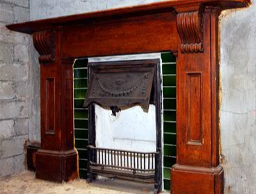 The cast iron fireplace originally in the former Marine Police Headquarters